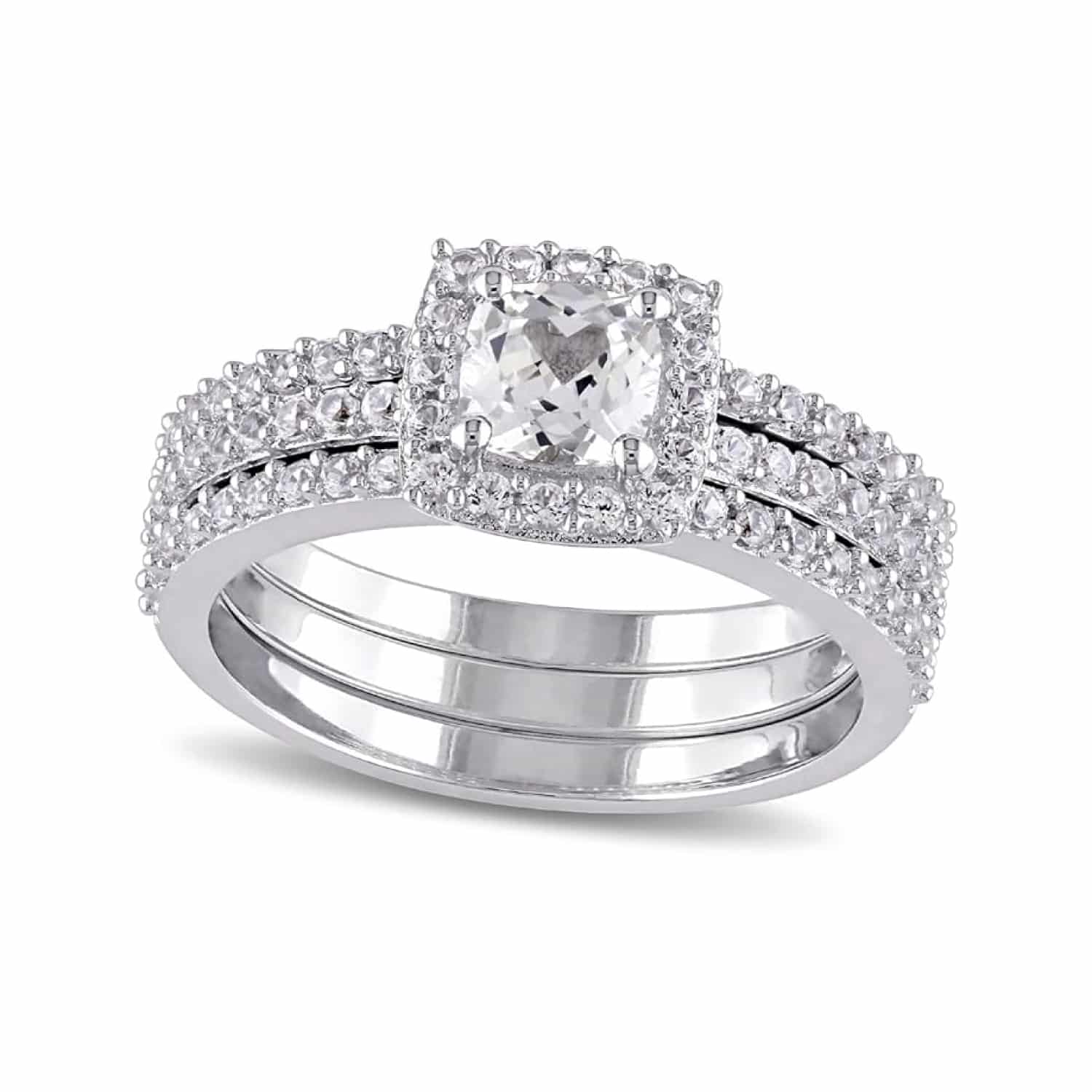 A 0.925 Sterling Silver and White Sapphire Rings engagement ring featuring an 0.72 CT Cushion Cut Lab Created White Sapphire center stone surrounded by 80 Round White Sapphires, totaling 1.29 Carat Total Weight.
