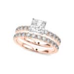 A 14K Rose Gold Cushion Cut Engagement Rings With Wedding Band set, featuring a large Cushion Cut Lab-Grown Diamond solitaire and a 0.5 ct diamond matching wedding band.