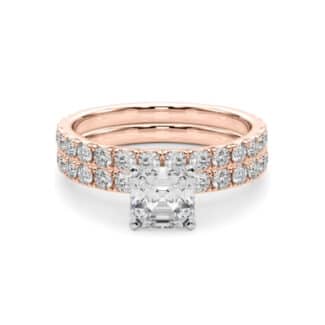 A 14K Rose Gold Cushion Cut Engagement Rings With Wedding Band set, featuring a large Cushion Cut Lab-Grown Diamond solitaire and a 0.5 ct diamond matching wedding band.