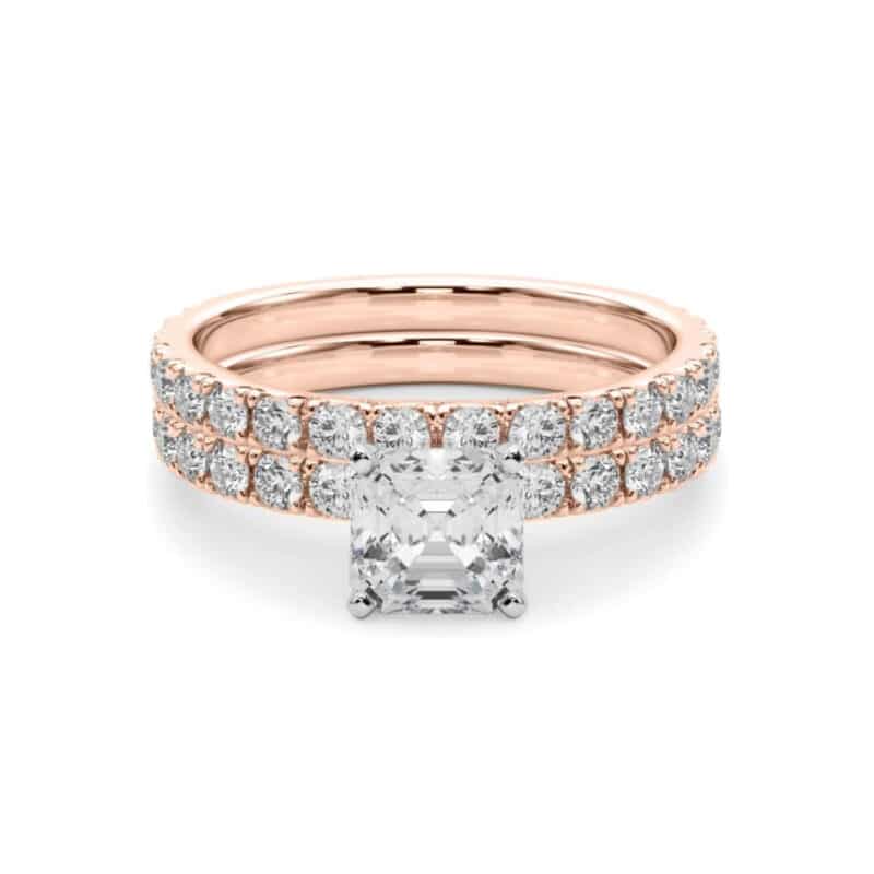 A 14K Rose Gold Cushion Cut Engagement Rings With Wedding Band set, featuring a large Cushion Cut Lab-Grown Diamond solitaire and a 0.5 ct diamond matching wedding band.