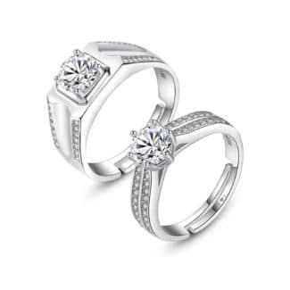 A set of Unique Matching Wedding Bands His and Hers in 0.925 Sterling Silver, featuring Round Natural Diamonds with D Color and VVS1 Clarity in a 1.0 Carat solitaire style.