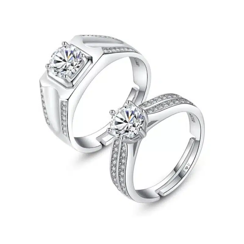 A set of Unique Matching Wedding Bands His and Hers in 0.925 Sterling Silver, featuring Round Natural Diamonds with D Color and VVS1 Clarity in a 1.0 Carat solitaire style.