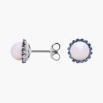 A pair of 14K White Gold Pearl and Sapphire Drop Earrings (Halo Stud style) featuring 7 mm Freshwater Cultured Pearls surrounded by a halo of 32 Round Blue Sapphires, secured with Push Backs.
