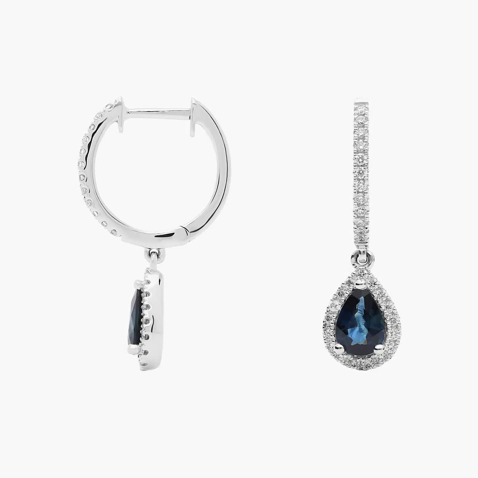A pair of 14K White Gold Sapphire and Diamond Dangle Earrings featuring two 6x4 mm Pear Shaped Blue Sapphires (1 CT total) and a 0.22 CTW Round Diamond Halo, secured with Hinged Snap Backs.