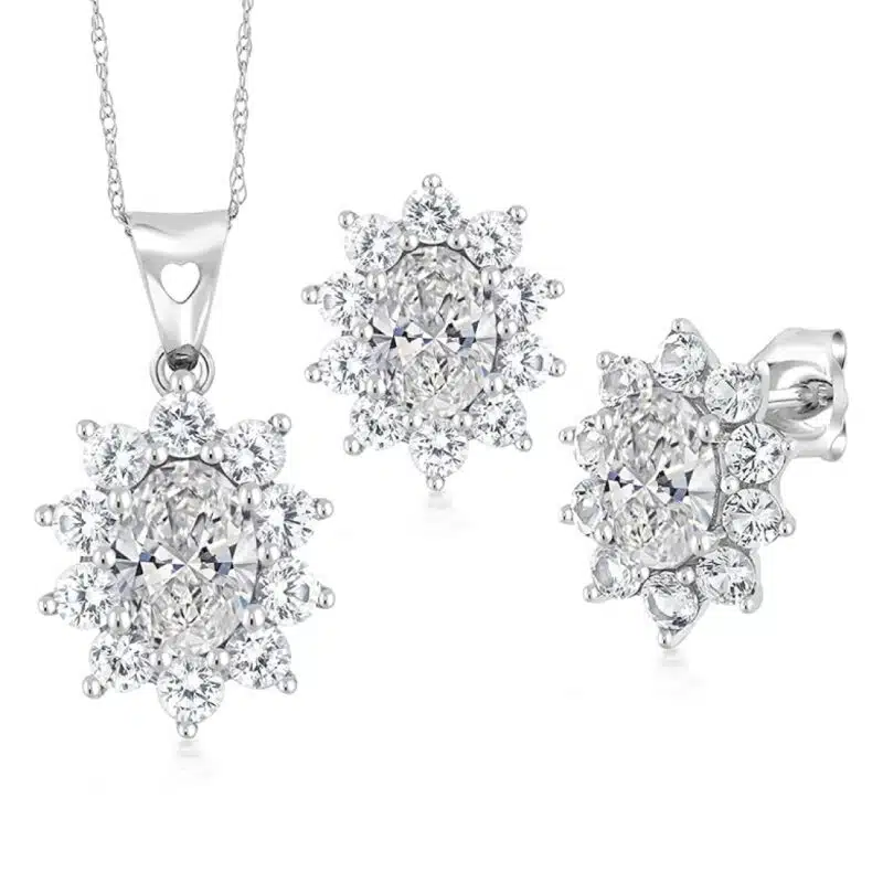 A 10K White Gold White Sapphire Earrings and Pendant Jewelry Set with 2.70 CTW total of Oval Lab Grown Diamonds (DEF/VVS-VS) and Round White Created Sapphires. Earrings have friction backs.