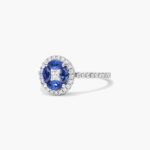 A 14K White Gold Princess Cut Diamond Ring with Sapphires, featuring four Marquise Blue Sapphires (0.62 CT min) set as flower petals, accented by a 0.18 CT Princess Cut Diamond and 0.28 CTW Round Diamonds.