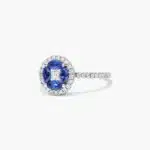 A 14K White Gold Princess Cut Diamond Ring with Sapphires, featuring four Marquise Blue Sapphires (0.62 CT min) set as flower petals, accented by a 0.18 CT Princess Cut Diamond and 0.28 CTW Round Diamonds.