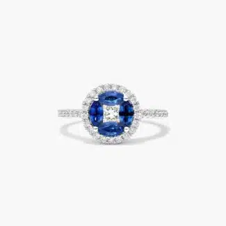 A 14K White Gold Princess Cut Diamond Ring with Sapphires, featuring four Marquise Blue Sapphires (0.62 CT min) set as flower petals, accented by a 0.18 CT Princess Cut Diamond and 0.28 CTW Round Diamonds.