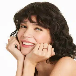 A Milgrain Embellished Ruby Eternity Ruby Wedding Rings For Women band (3.00mm) in 14K Yellow Gold with 2.25 CTW Round Rubies and diamond accents.