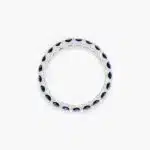 A 14K White Gold Blue Sapphire and Diamond Wedding Ring Sets component: a 3.00 mm Milgrain Embellished Eternity Band with 2.25 Carat minimum Round Blue Sapphires and 0.11 CTW diamond accents.