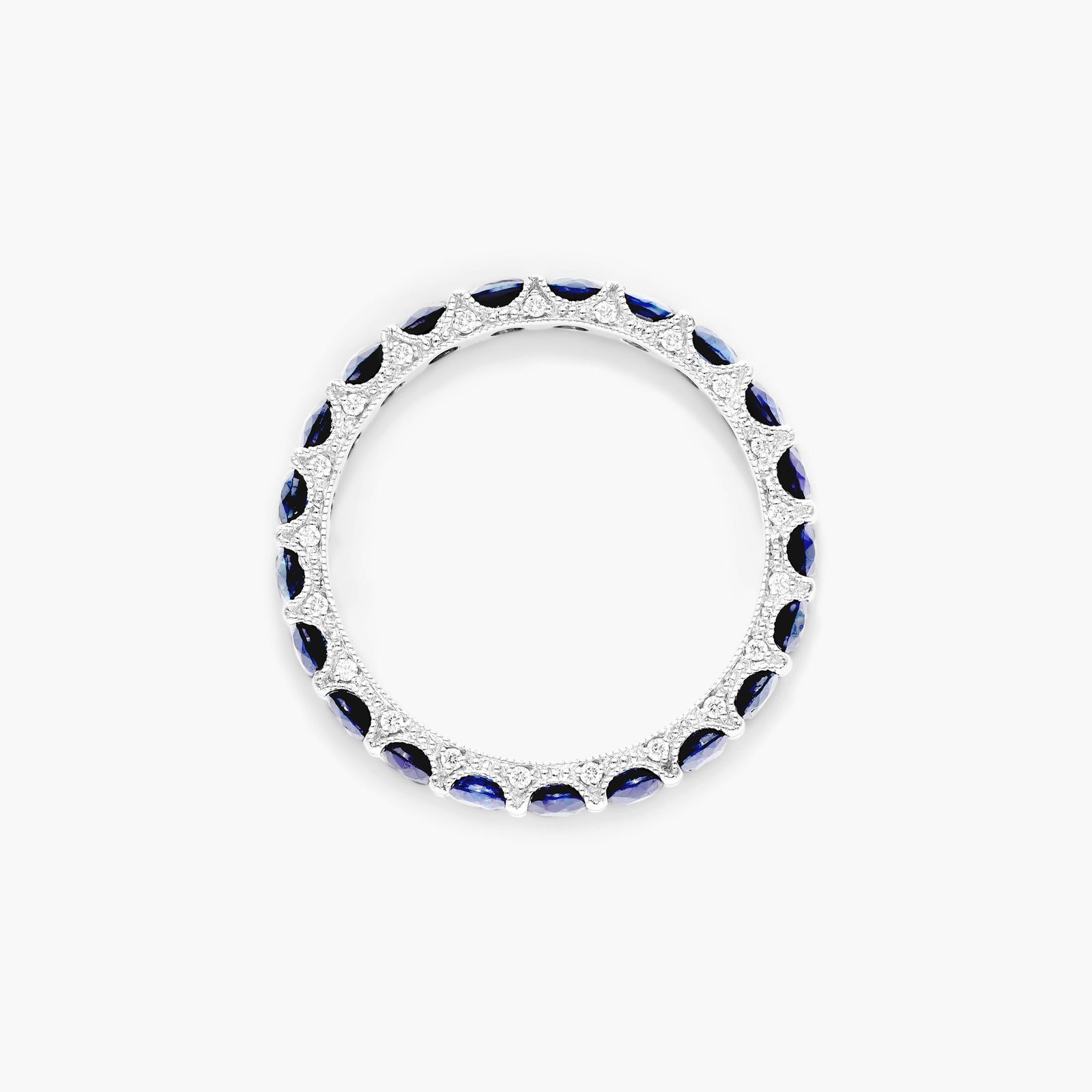 A 14K White Gold Blue Sapphire and Diamond Wedding Ring Sets component: a 3.00 mm Milgrain Embellished Eternity Band with 2.25 Carat minimum Round Blue Sapphires and 0.11 CTW diamond accents.