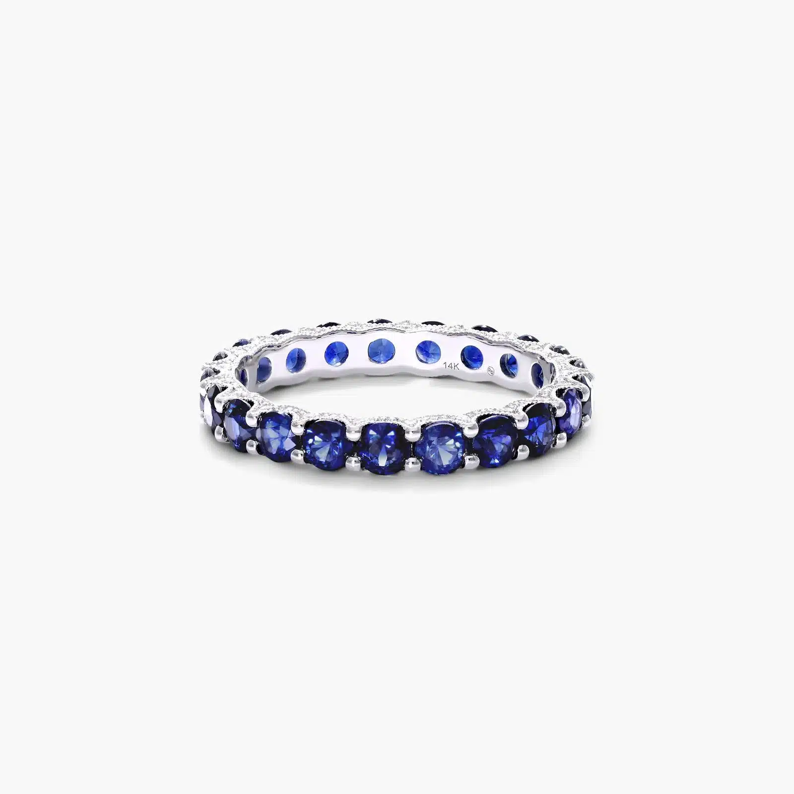 milgrain-eternity-blue-sapphire-diamond-wedding-ring-sets-14k-white-gold A 14K White Gold Blue Sapphire and Diamond Wedding Ring Sets component: a 3.00 mm Milgrain Embellished Eternity Band with 2.25 Carat minimum Round Blue Sapphires and 0.11 CTW diamond accents.