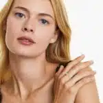 A 14K Rose Gold Open Ring Opal Wedding Rings For Women with asymmetrically set Marquise Cabochon Opals (0.46 CTW min) and Round Diamond accents.