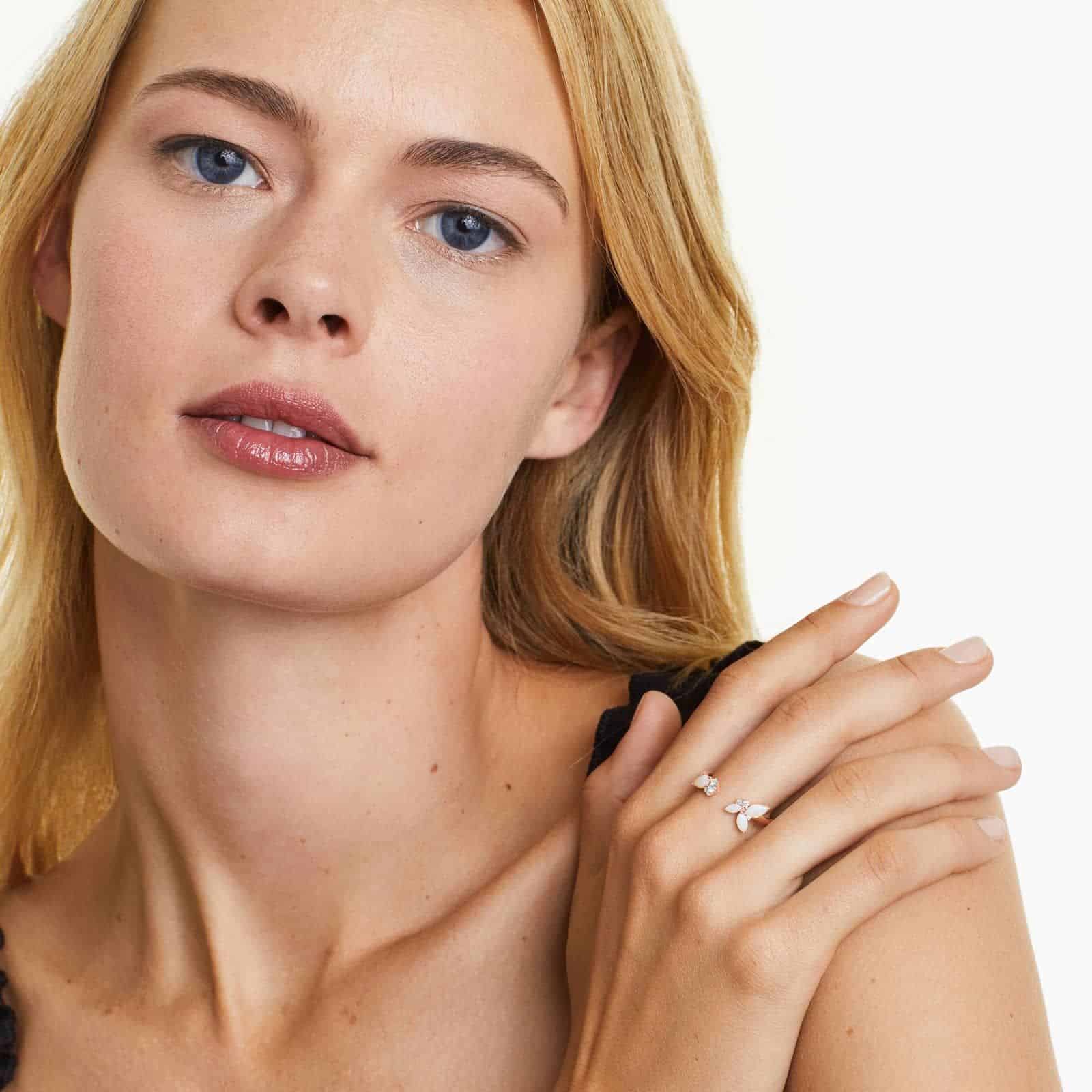 A 14K Rose Gold Open Ring Opal Wedding Rings For Women with asymmetrically set Marquise Cabochon Opals (0.46 CTW min) and Round Diamond accents.