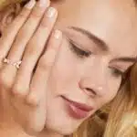 A 14K Rose Gold Open Ring Opal Wedding Rings For Women with asymmetrically set Marquise Cabochon Opals (0.46 CTW min) and Round Diamond accents.