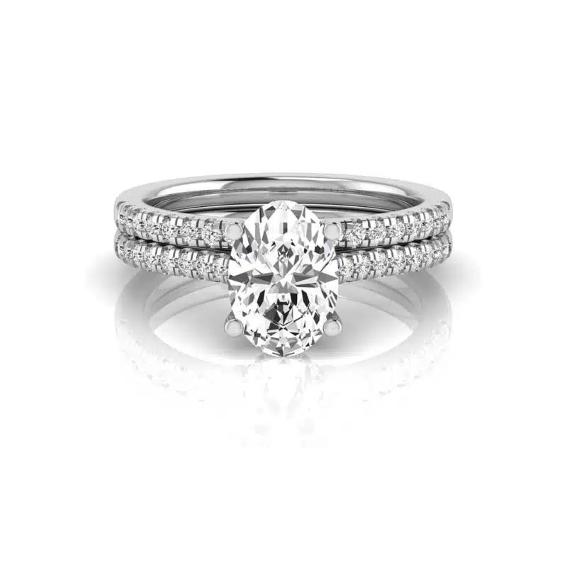 An IGI Certified Stacked Wedding Bands With Engagement Ring set in 14K White Gold featuring a 2.00 CT Oval Lab-Grown Diamond and a 0.50 CTW stackable wedding band.