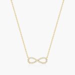 14K yellow gold infinity necklaces valentine's day jewelry for her featuring a diamond pavé infinity symbol on a 16-inch cable chain.