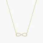 14K yellow gold infinity necklaces valentine's day jewelry for her featuring a diamond pavé infinity symbol on a 16-inch cable chain.