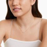 14K yellow gold infinity necklaces valentine's day jewelry for her featuring a diamond pavé infinity symbol on a 16-inch cable chain.