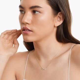 14K yellow gold infinity necklaces valentine's day jewelry for her featuring a diamond pavé infinity symbol on a 16-inch cable chain.