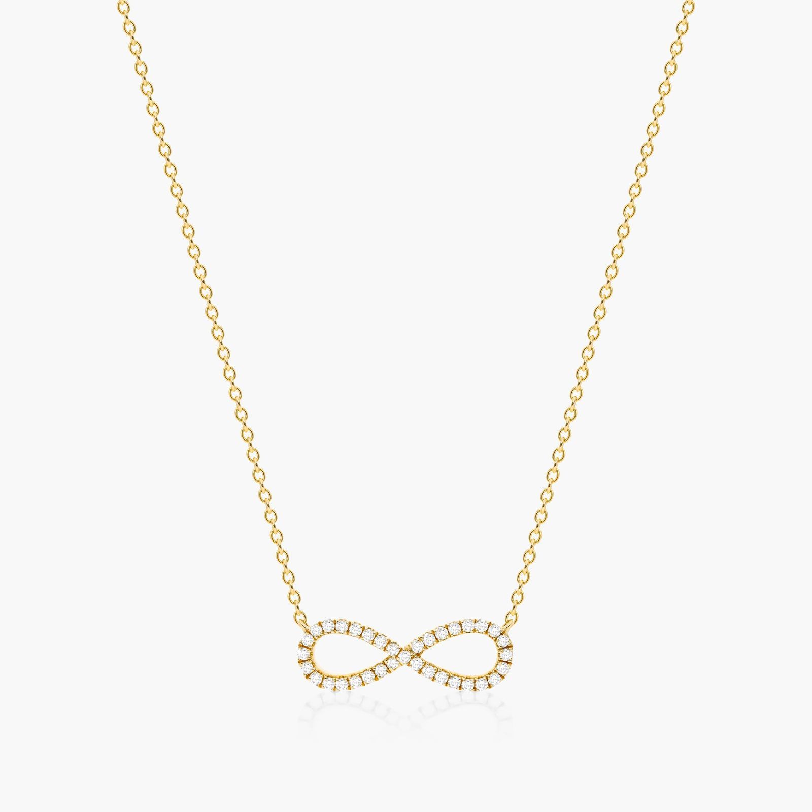 14K yellow gold infinity necklaces valentine's day jewelry for her featuring a diamond pavé infinity symbol on a 16-inch cable chain.