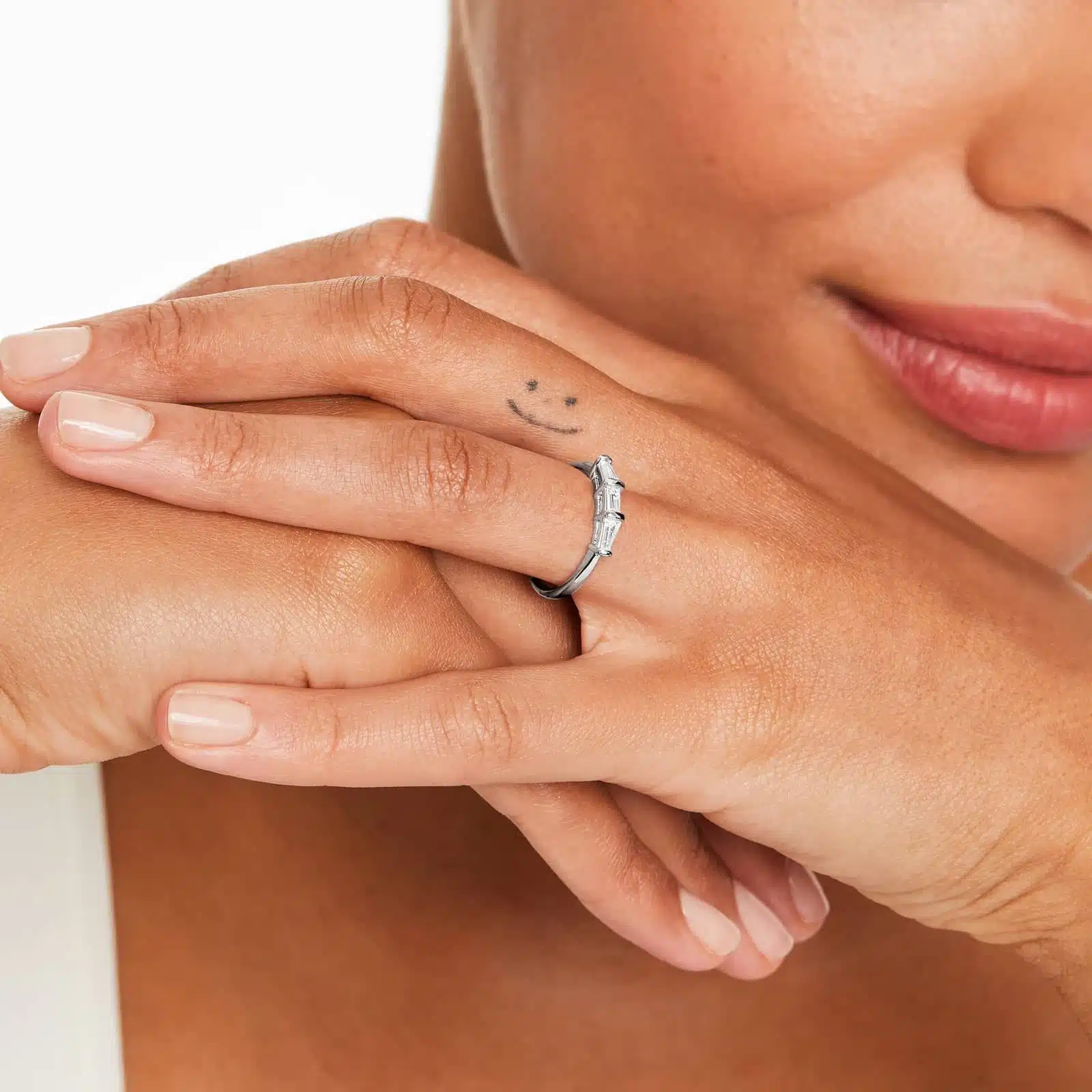 A 2.00 mm Platinum Tapered Baguette Wedding Band featuring three Natural Tapered Baguette Diamonds totaling 0.33 CTW.