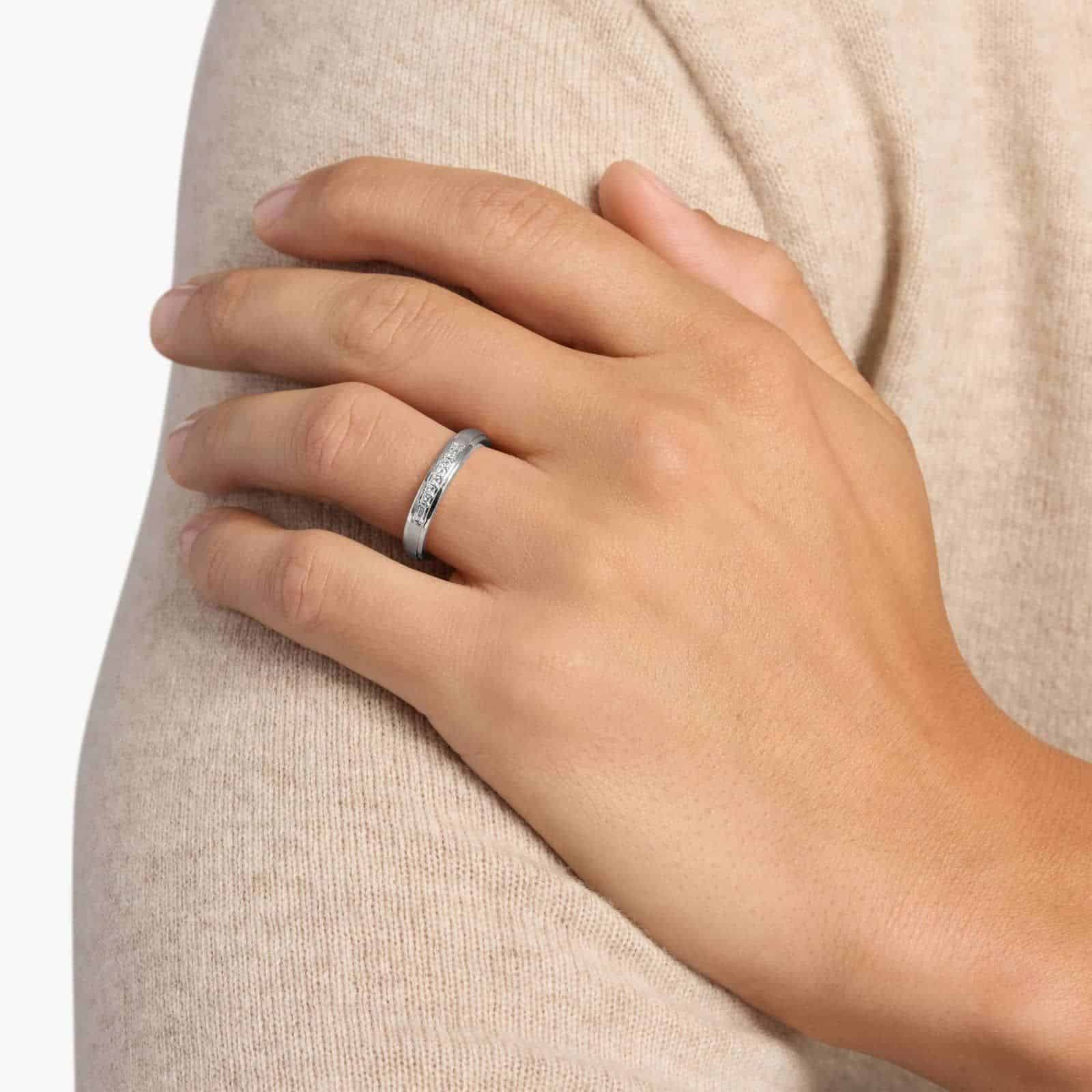 A 3.60 mm wide Platinum Mens Wedding Bands With Baguettes featuring an alternating pattern of Baguette and Princess Cut natural diamonds (1/5 CTW).