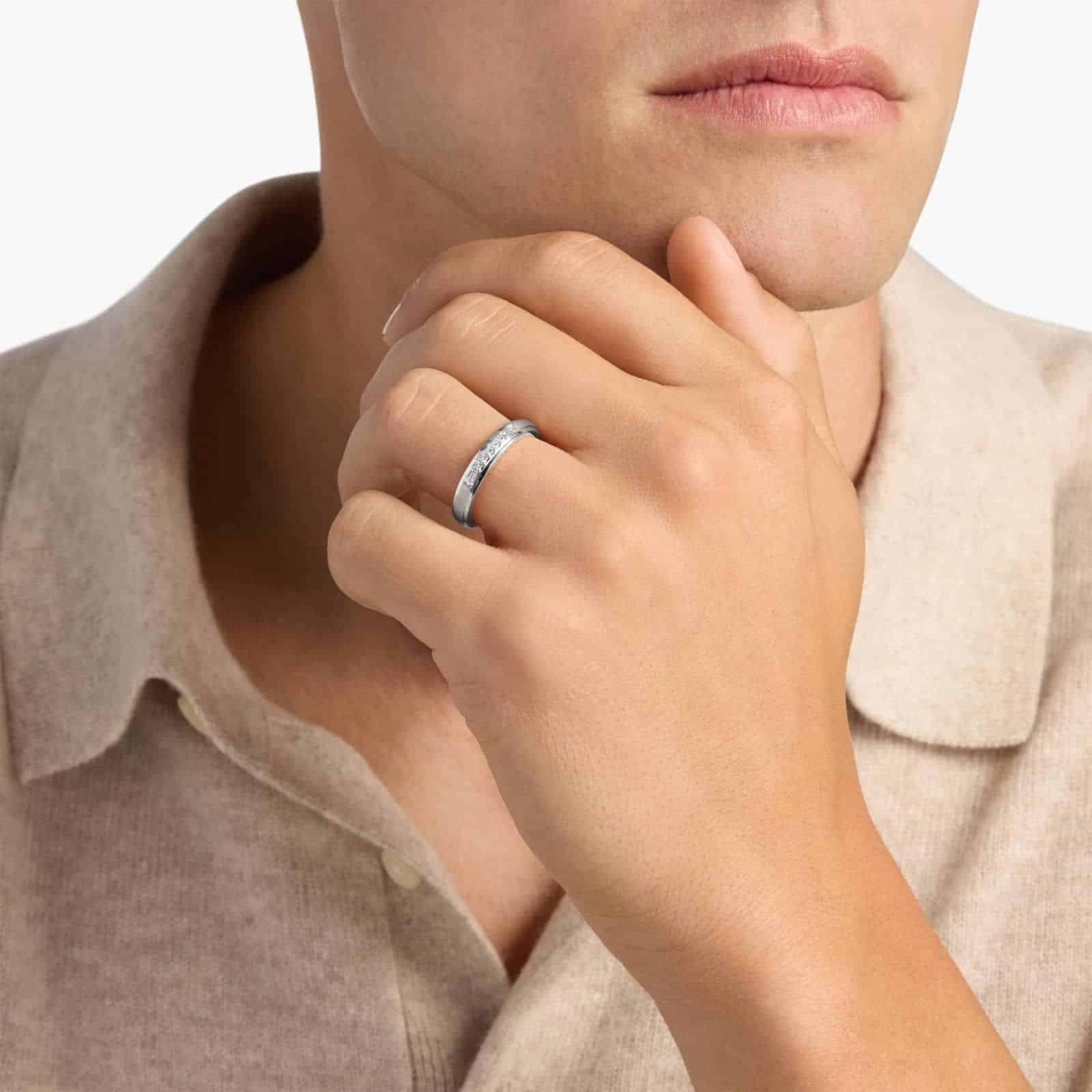 A 3.60 mm wide Platinum Mens Wedding Bands With Baguettes featuring an alternating pattern of Baguette and Princess Cut natural diamonds (1/5 CTW).