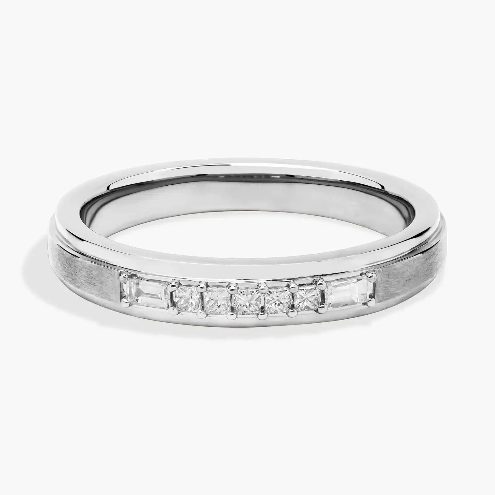 A 3.60 mm wide Platinum Mens Wedding Bands With Baguettes featuring an alternating pattern of Baguette and Princess Cut natural diamonds (1/5 CTW).