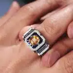 A 0.925 Sterling Silver Yellow Sapphire Ring for Men: a 1 Carat Rectangular Created Yellow Sapphire set in a Halo style, with an Eye Clean clarity grade.