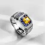 A 0.925 Sterling Silver Yellow Sapphire Ring for Men: a 1 Carat Rectangular Created Yellow Sapphire set in a Halo style, with an Eye Clean clarity grade.