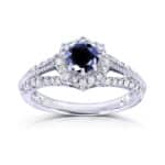 A 14K White Gold Art Deco Vintage Sapphire Rings engagement ring featuring a 0.7 Carat Round Natural Blue Sapphire center, a 0.3 CTW diamond Halo, and vintage detailing (1.0 CTW total).