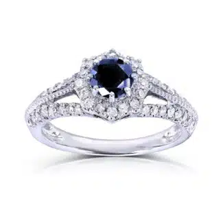 A 14K White Gold Art Deco Vintage Sapphire Rings engagement ring featuring a 0.7 Carat Round Natural Blue Sapphire center, a 0.3 CTW diamond Halo, and vintage detailing (1.0 CTW total).