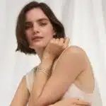 14K yellow gold emerald cut lab grown diamond tennis bracelets under $3000 featuring 2 CTW bezel-set diamonds and a paperclip chain.