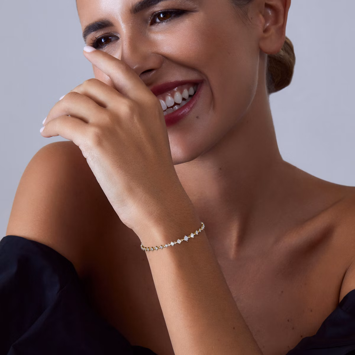 Infinity Linked 1.70 CTW Graduated Lab Diamond Bracelet - Lab Grown Diamond Tennis Bracelets Under $3000 model view 14K yellow gold graduated lab grown diamond tennis bracelets under $3000 featuring 1.70 CTW of VRAI created colorless diamonds.