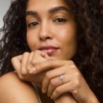 Platinum oval micropavé engagement rings under $2,500 featuring a 1 carat oval lab grown diamond and 22 natural diamond accents on a 1.70mm shank.