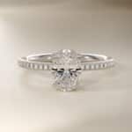 Platinum oval micropavé engagement rings under $2,500 featuring a 1 carat oval lab grown diamond and 22 natural diamond accents on a 1.70mm shank.