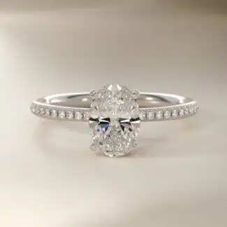 Platinum oval micropavé engagement rings under $2,500 featuring a 1 carat oval lab grown diamond and 22 natural diamond accents on a 1.70mm shank.