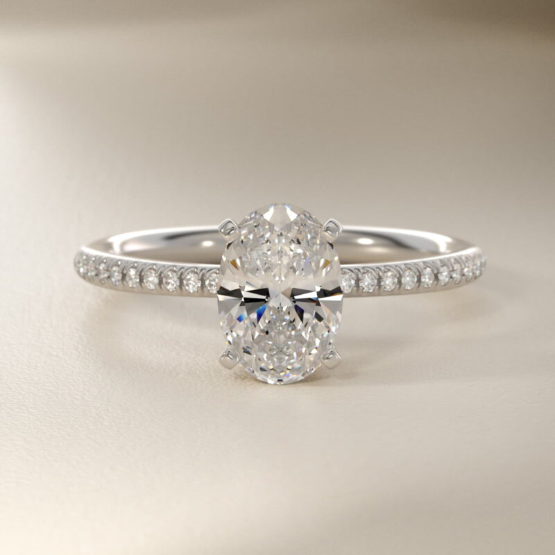 Platinum oval micropavé engagement rings under $2,500 featuring a 1 carat oval lab grown diamond and 22 natural diamond accents on a 1.70mm shank.