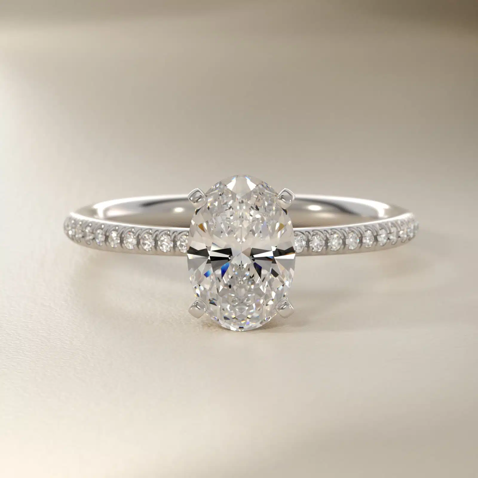 Platinum oval micropavé engagement rings under $2,500 featuring a 1 carat oval lab grown diamond and 22 natural diamond accents on a 1.70mm shank.