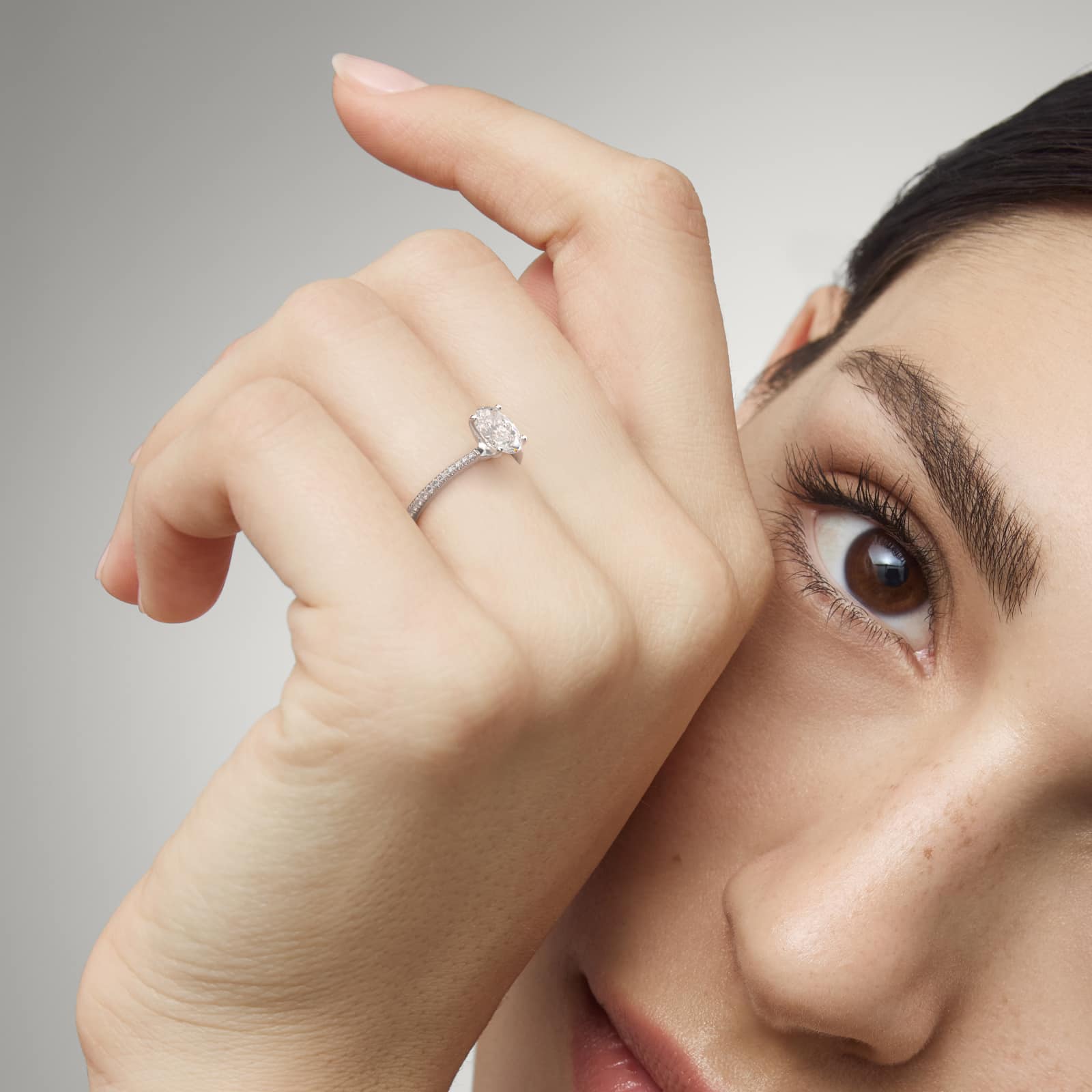 Platinum oval micropavé engagement rings under $2,500 featuring a 1 carat oval lab grown diamond and 22 natural diamond accents on a 1.70mm shank.