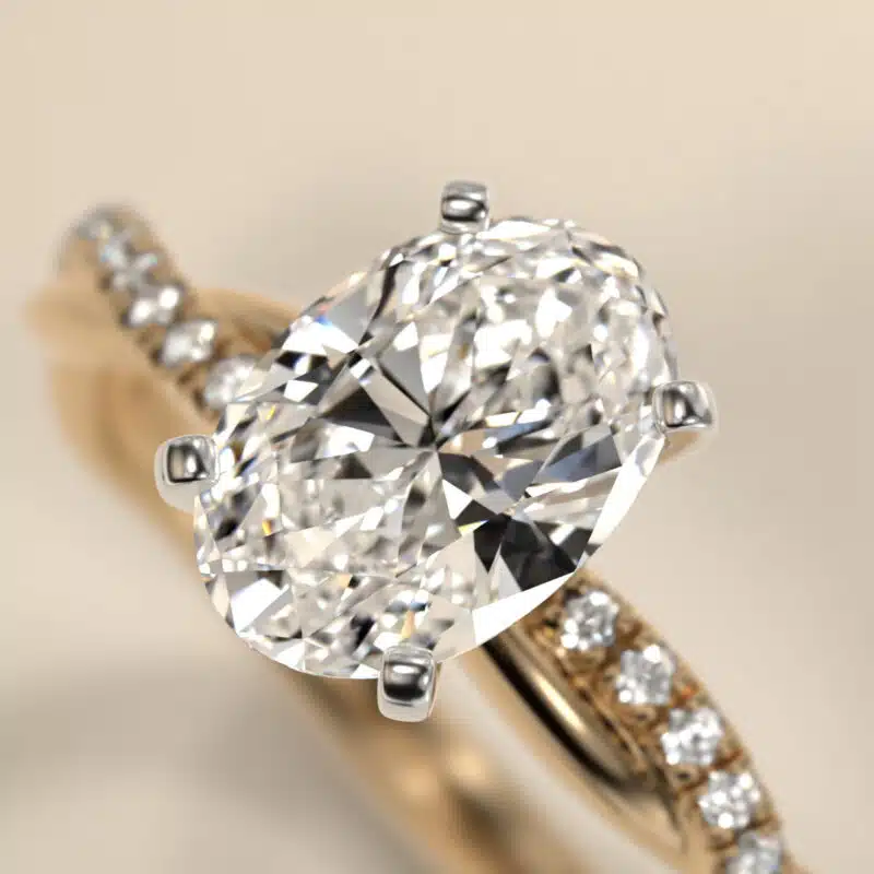 14K yellow gold oval twist engagement rings under $2,500 featuring a 1 carat oval lab grown diamond and 20 natural diamond accents on a 2.80mm shank.