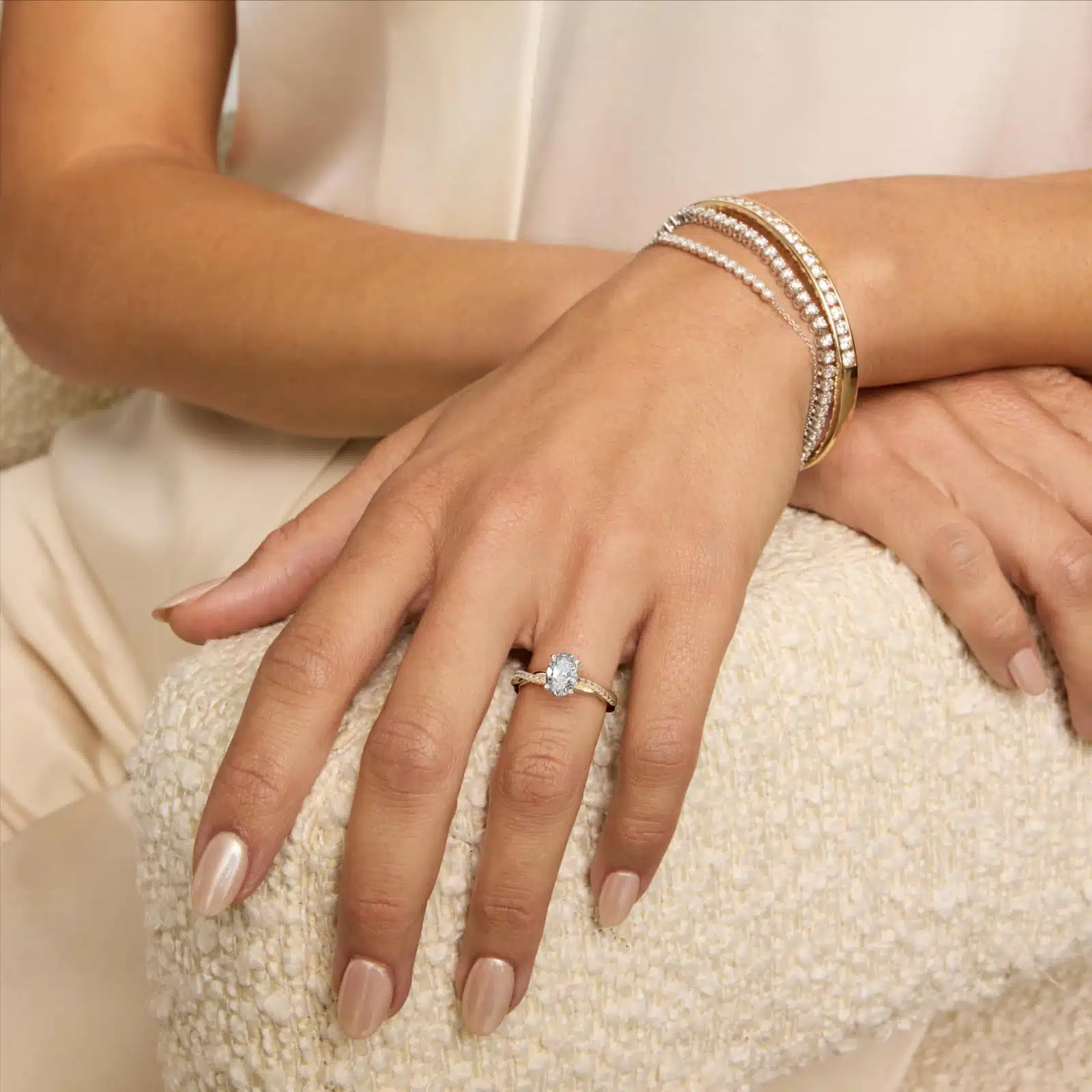 14K yellow gold oval twist engagement rings under $2,500 featuring a 1 carat oval lab grown diamond and 20 natural diamond accents on a 2.80mm shank.