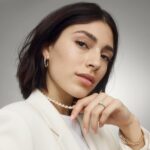 14K yellow gold oval twist engagement rings under $2,500 featuring a 1 carat oval lab grown diamond and 20 natural diamond accents on a 2.80mm shank.