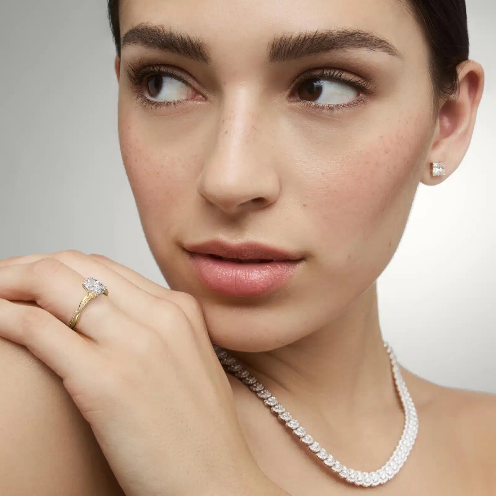 14K yellow gold oval twist engagement rings under $2,500 featuring a 1 carat oval lab grown diamond and 20 natural diamond accents on a 2.80mm shank.