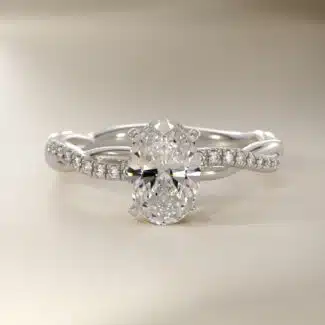 Platinum oval twist engagement rings under $2,500 featuring a 1 carat oval lab grown diamond and 20 natural diamond accents on a 2.80mm shank.