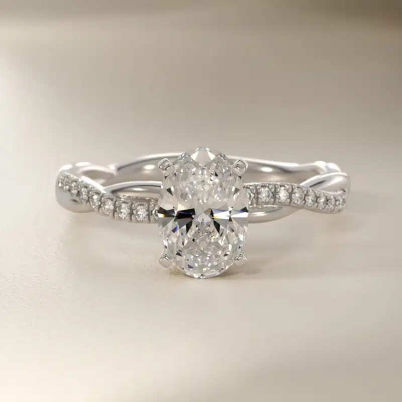 Platinum oval twist engagement rings under $2,500 featuring a 1 carat oval lab grown diamond and 20 natural diamond accents on a 2.80mm shank.