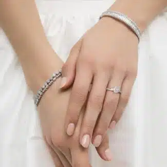 Platinum oval twist engagement rings under $2,500 featuring a 1 carat oval lab grown diamond and 20 natural diamond accents on a 2.80mm shank.