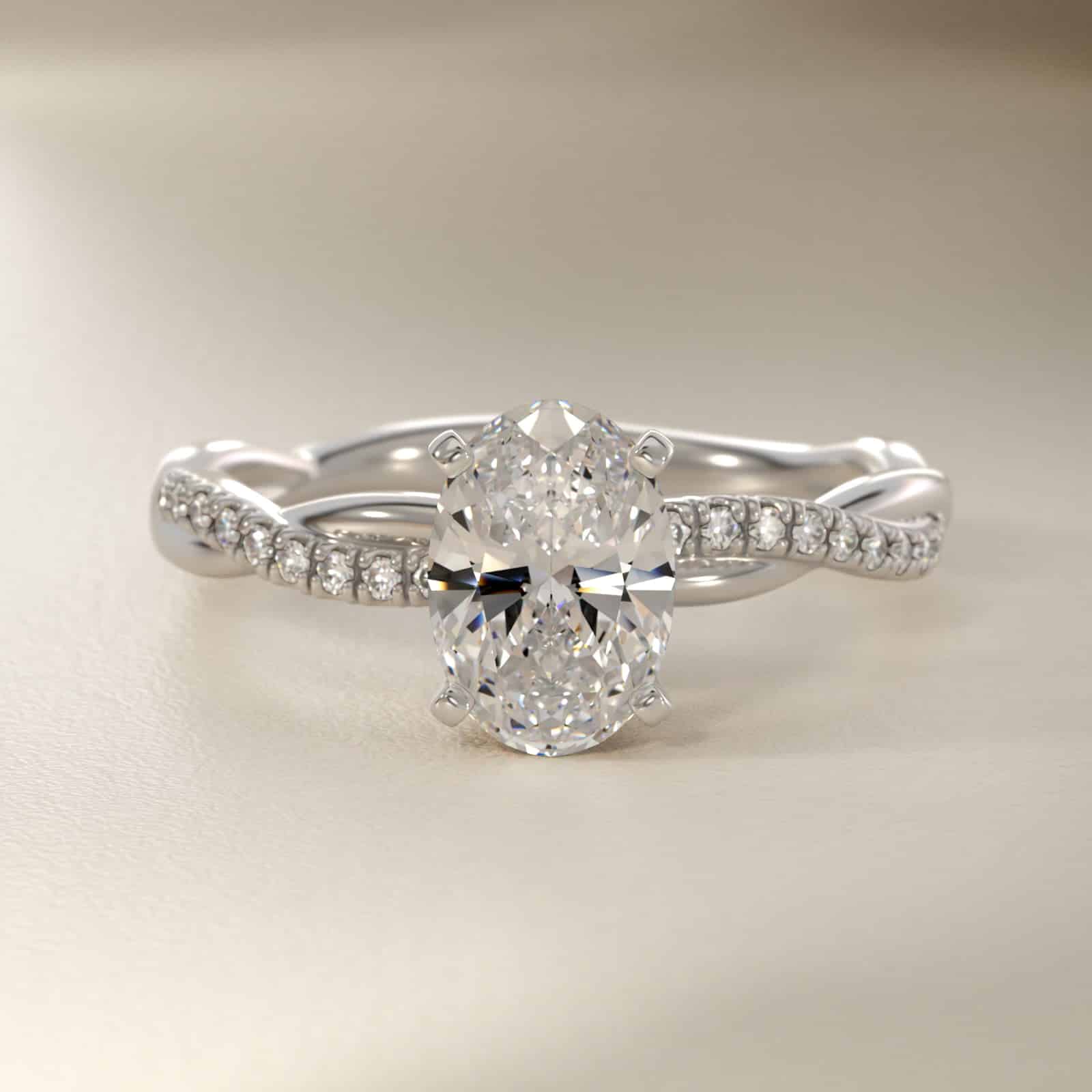 Platinum oval twist engagement rings under $2,500 featuring a 1 carat oval lab grown diamond and 20 natural diamond accents on a 2.80mm shank.