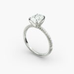 Platinum oval petite pavé engagement rings under $2,500 featuring a 1.5 carat oval lab-grown diamond and 20 French cut natural diamonds.